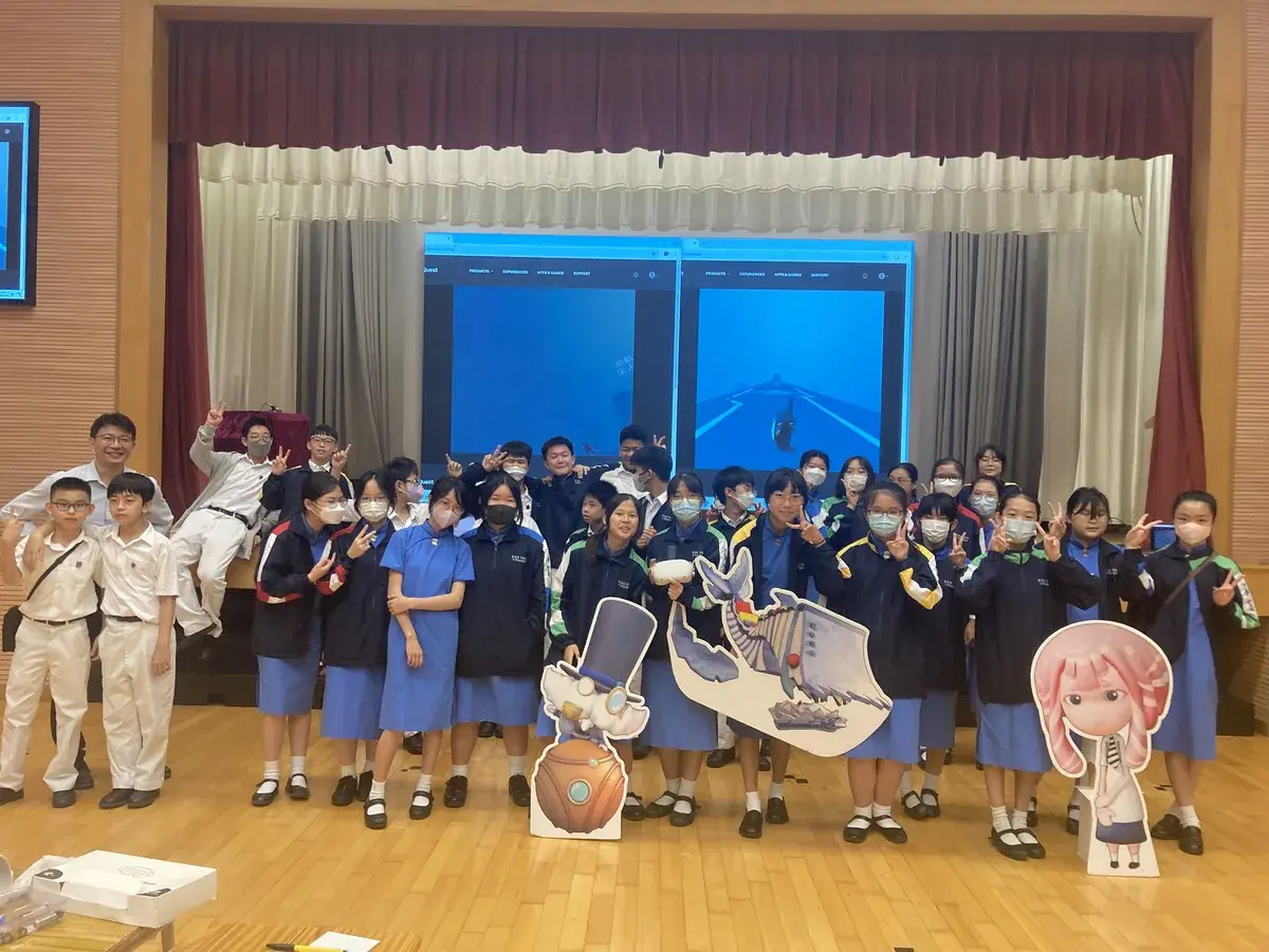 Students presenting a digital game project at school.