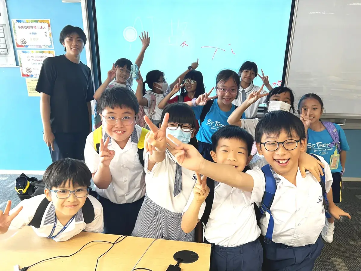 Primary school students celebrating after a creative workshop.