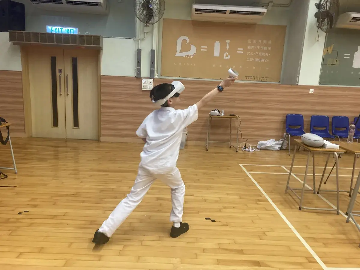 A student trying a virtual reality experience during a school activity.